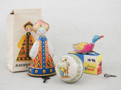 two figurines that are next to a box of matches