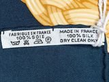 the label on the back of a yellow and blue tie