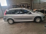 a silver car that is parked in a garage