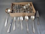 a box full of silverware with spoons and forks