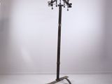 a tall metal pole with five lights on it