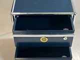 three metal boxes that are stacked on top of each other
