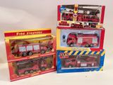 three fire trucks that are sitting in the boxes
