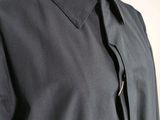 a close up of a dress shirt with a tie on a mannequin dummy