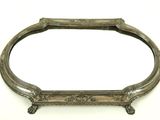 an antique silver plated mirror with ornate design on a white background