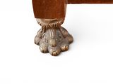 a close up of a wooden table with a metal base