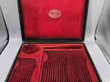 a red case with a set of silverware in it