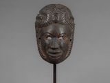 a bronze head of a man with a beard on a stand