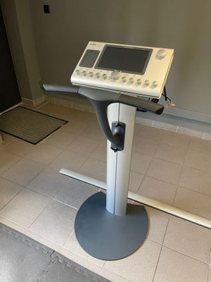 a medical equipment sitting on a stand in a room