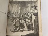 an open book with a drawing of a woman standing in front of a group of people