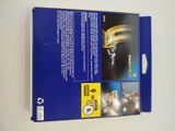 the back of a blue box with a picture of a train on it