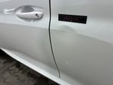 a white car with a sticker on the side of it