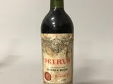 a bottle of wine that is sitting on a table