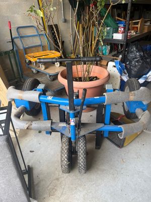 a plant that is sitting on a cart in the garage