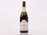 a bottle of wine that is sitting on a table