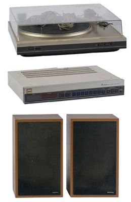 two speakers and a turntable on a white background