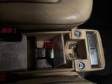 a picture of a car ' s center console with a lot of things in it