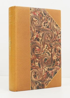 a brown book with a floral design on the cover