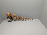 many vases that are lined up on a white table