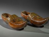 two wooden shoes that are sitting on a table