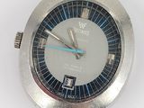 a silver watch with a blue second hand on a white surface