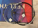 two wheels that are sitting next to each other on the floor