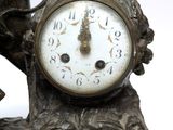 a bronze statue of an elephant with a clock on it