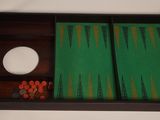 a tray with a game board and a bowl of dices on it