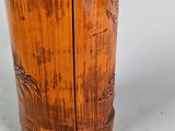 a wooden cup that has a design on it