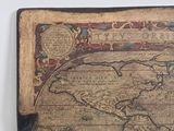 an old world map on a piece of paper on a table
