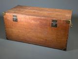a wooden trunk with a metal latch on it