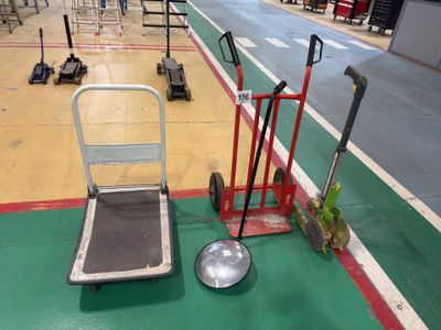 a hand truck and a dolly on the floor in a warehouse