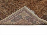 a close up of a rug on a white surface