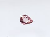 a close up of a pink diamond on a white background