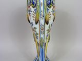 an image of a decorative vase with a bird on it