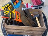 a wooden box with tools in it on the ground