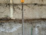 a pole with a light on top of it in a building