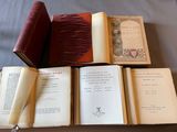 several open books sitting on top of a table next to each other