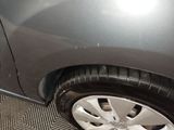 a close up of a car tire on the ground