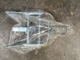 a plastic umbrella that is sitting on the ground