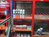 a shelf with many different types of paint on it