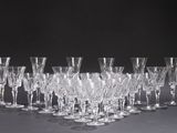 a lot of empty wine glasses sitting on a table