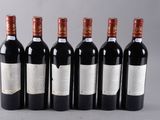 six bottles of red wine are lined up in a row