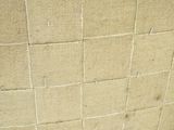 a piece of cardboard on the floor next to a wall
