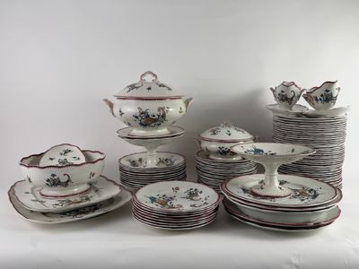 a lot of plates and cups that are sitting on a table