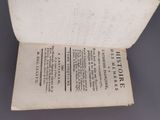an open book with a black and white title on it