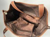 leather handbag with two compartments and a zippered closure