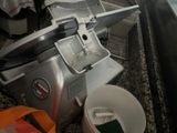 a machine that is sitting on a counter with a bucket