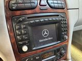 a radio in the center of a car with a mercedes logo on it