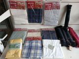 many different types of clothing on display on a table